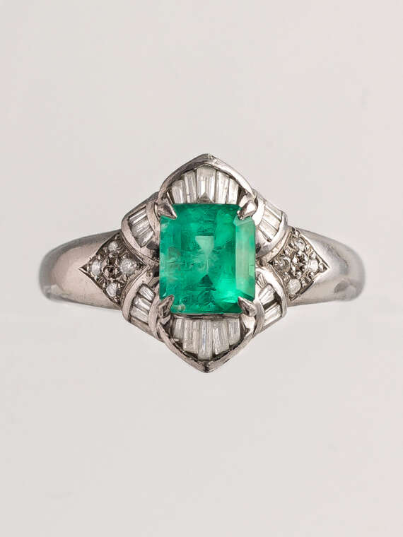 A Spark of Green Emerald Diamond Ring